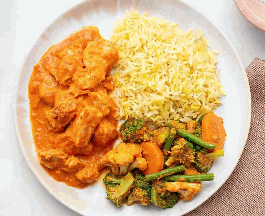 Chicken tikka masala with cauliflower and potato curry, saffron basmati rice
