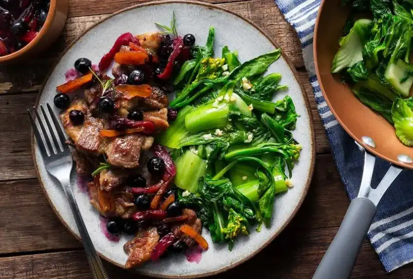 Seared-Pork-with-Blueberry-Apricot-Sauce-and-Sauteed-Greens