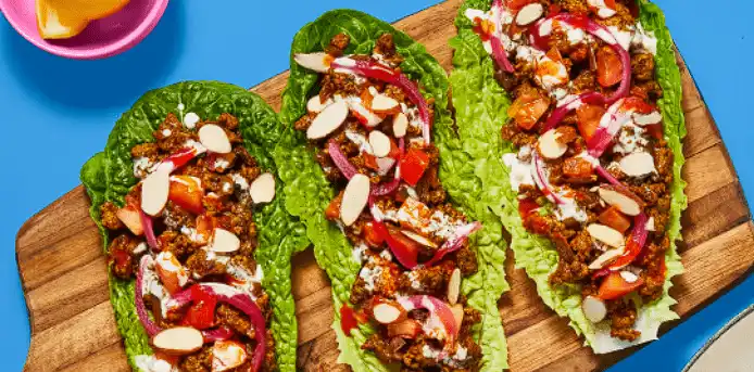 One-Pan-Spiced-Turkey-Lettuce-Wraps-with-Tomato-Garlicky-White-Sauce-Almonds-Hot-Sauce-min