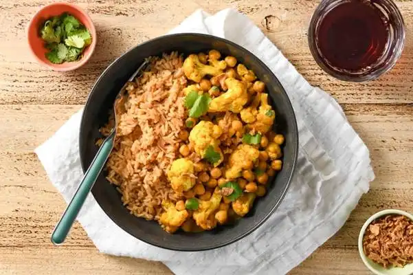 Indian-Style-Cauliflower-and-Chickpea-Curry-with-rice-crispy-onions-and-cilantro