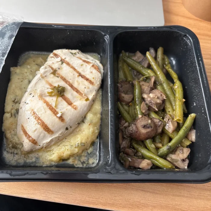 Reader photo of grilled chicken over Yukon mash with green beans and mushrooms in a Factor tray