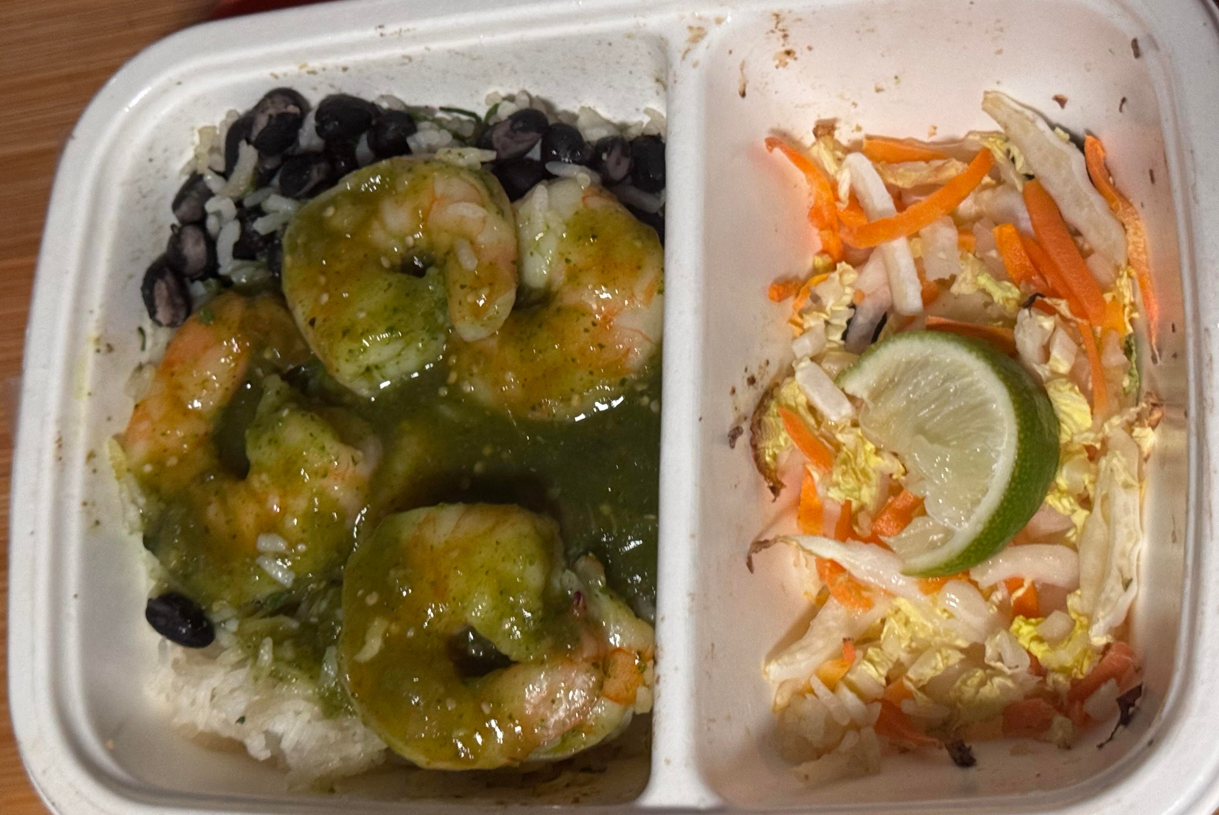 CookUnity adobo verde shrimp bowl with green sauce, rice, black beans and a lime slaw