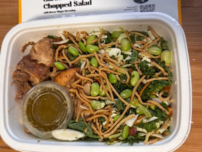 CookUnity garlic soy chicken chopped salad with crispy noodles, edamame and kale