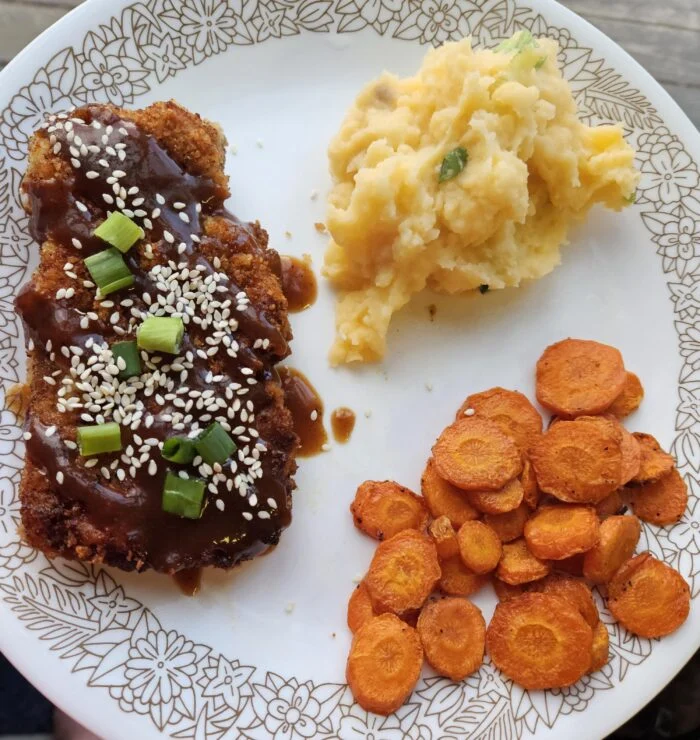 HelloFresh panko crusted pork katsu with sauce, sesame seeds and scallions, roasted carrots and mashed potatoes