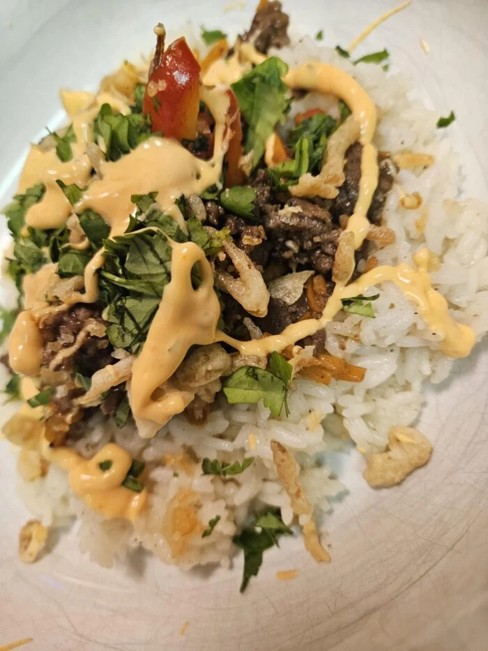 HelloFresh sesame soy beef bowl over jasmine rice with sriracha mayo, crispy onions and cilantro