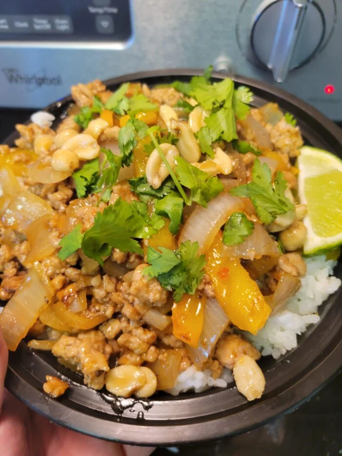 HelloFresh sweet chili pork bowl with ground pork, peppers, onion, peanuts, cilantro and lime over rice