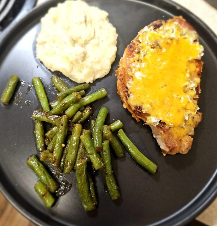 Jalapeno Cheddar Pork Chops with Chipotle Green Beans from Home Chef, photographed by u/cera84.