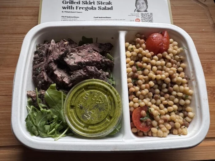 CookUnity grilled skirt steak with fregola salad in the tray