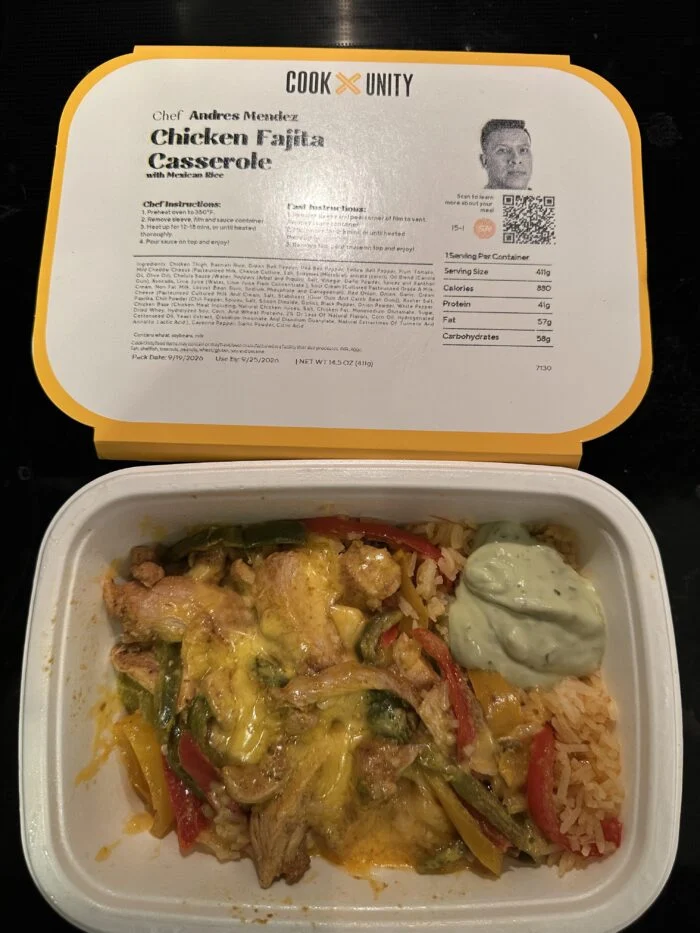 CookUnity chicken fajita casserole with peppers and melted cheese beside Mexican rice and a green sauce, chef label open behind the tray