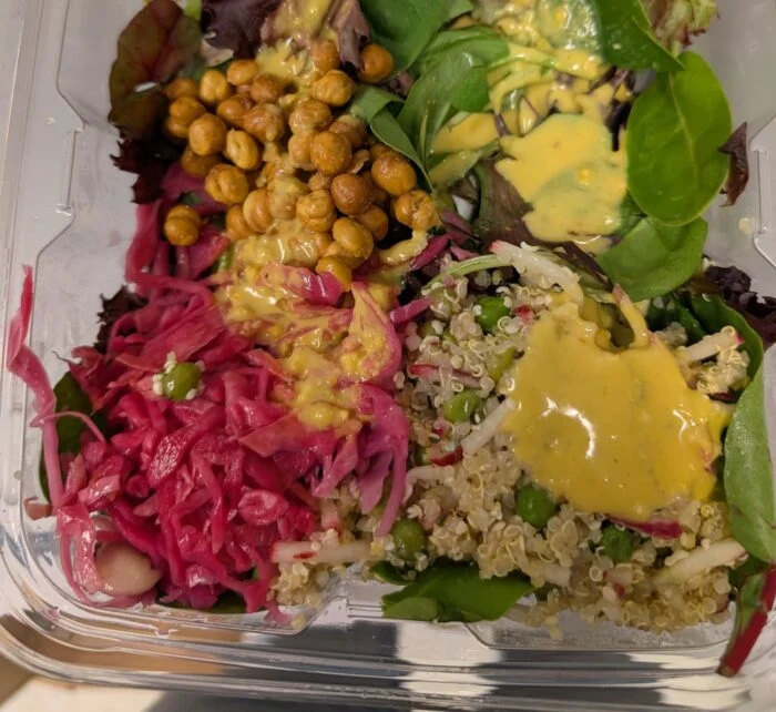 Thistle Golden Tahini Salad after the turmeric dressing has been poured over it