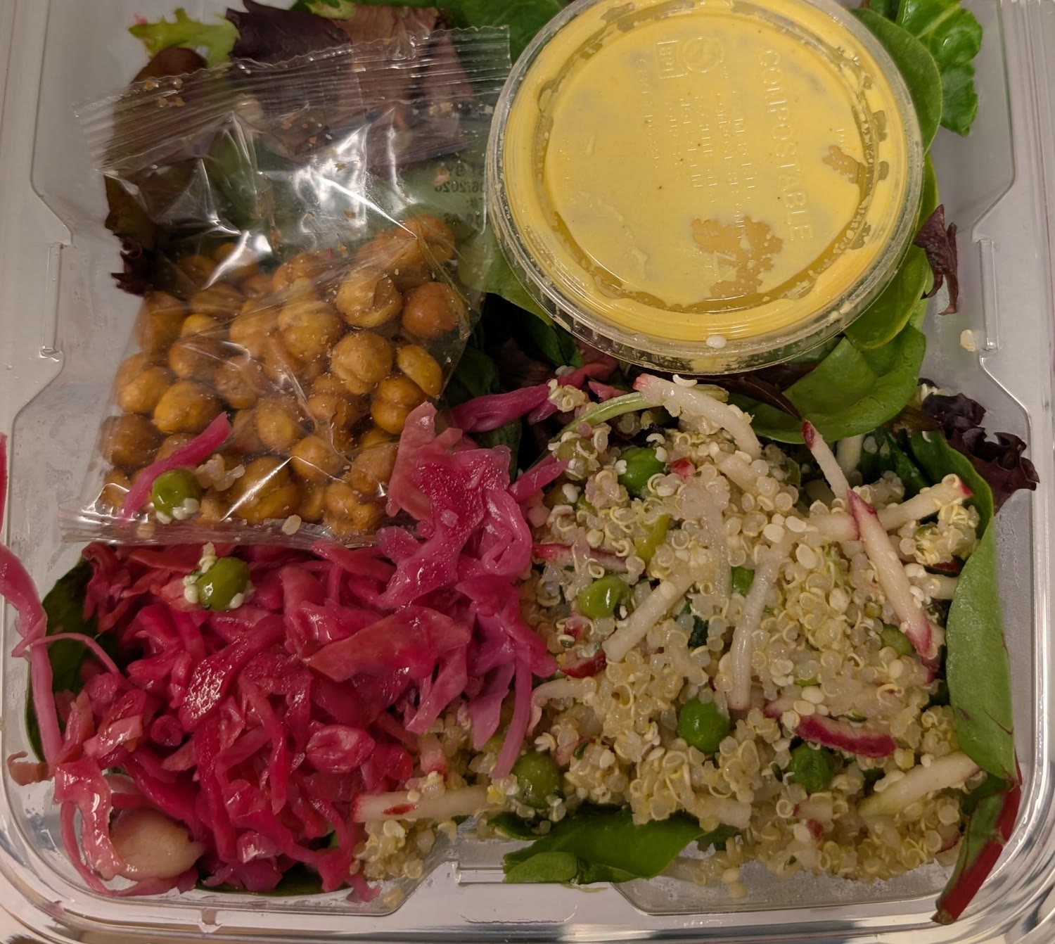 Thistle Golden Tahini Salad in its clear container, dressing cup and chickpea packet unopened