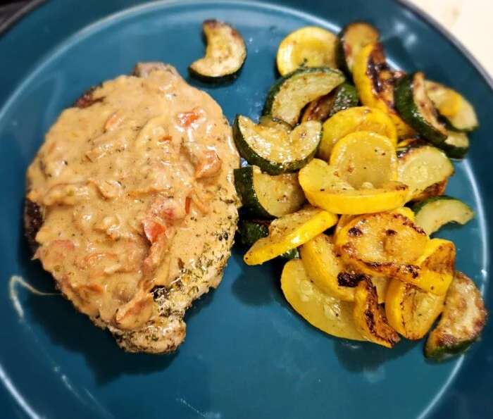 Herbed Tomato Cream Pork Chop with Summer Squash Medley from Home Chef, photographed by u/cera84.