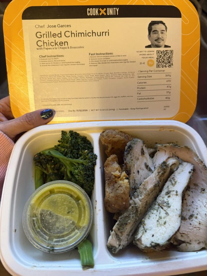 CookUnity grilled chimichurri chicken with papas a la chapa and broccolini in its tray.
