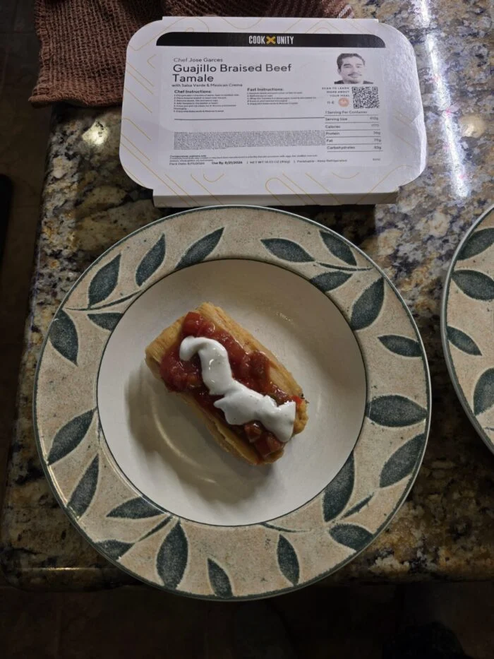 CookUnity guajillo braised beef tamale with red salsa, plated by a reader.