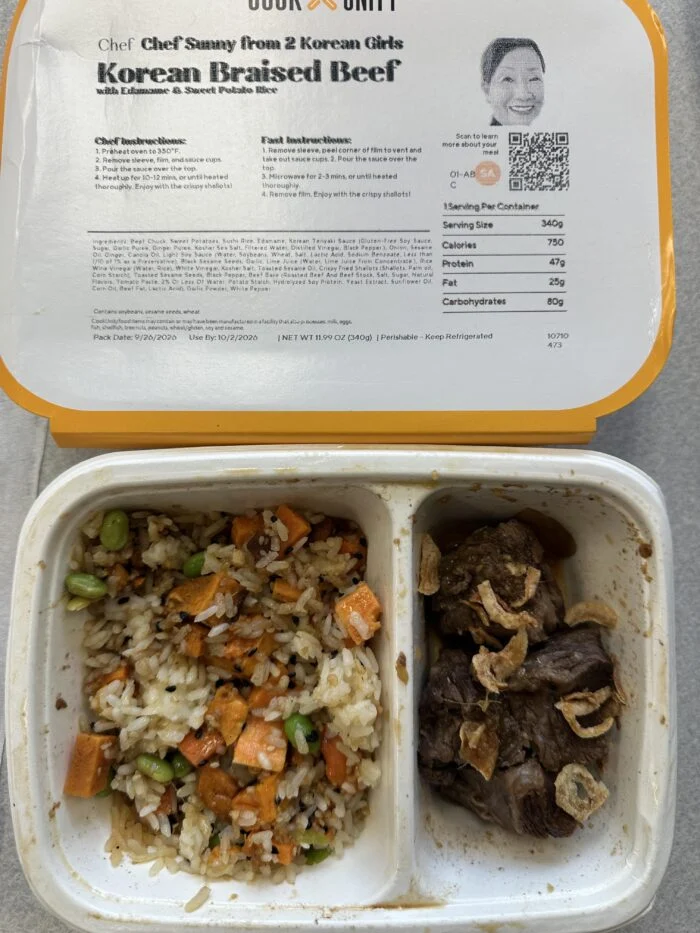 CookUnity Korean braised beef next to edamame and sweet potato rice in the tray, chef label behind