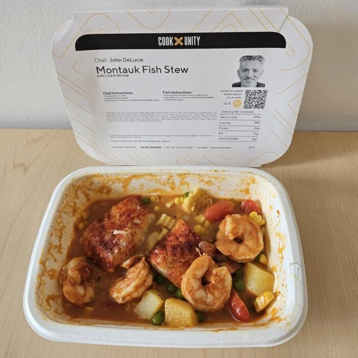 CookUnity Montauk fish stew with shrimp, cod and vegetables in its tray.