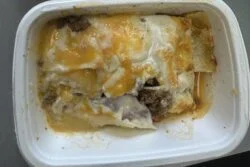 Reader photo of CookUnity pasticho Venezuelan ground beef lasagna with bechamel and melted cheese in its delivery tray