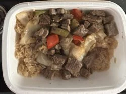 Reader photo of CookUnity Peruvian beef fried rice with beef, peppers and onion in its delivery tray