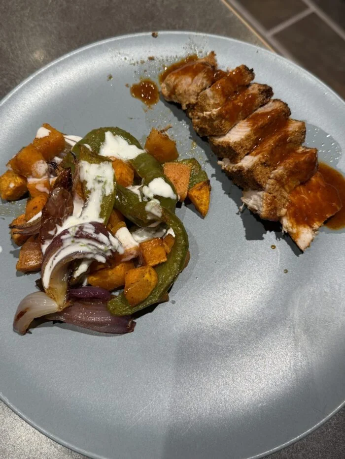 Reader-prepared HelloFresh pork filet with sweet potato, poblano, red onion and lime crema