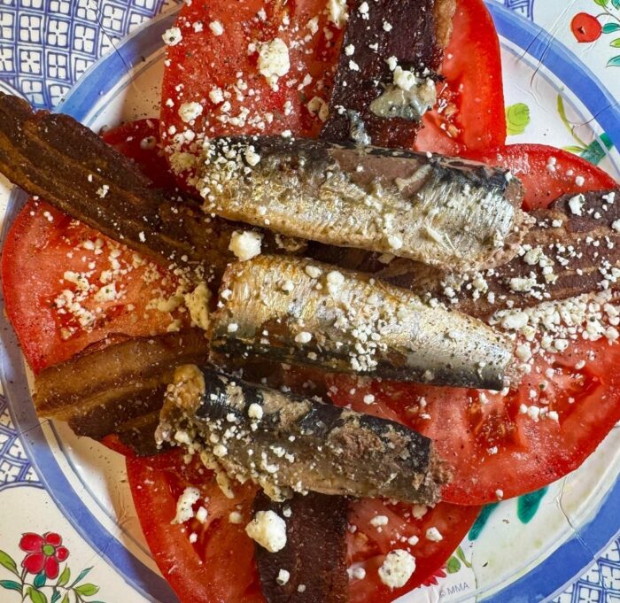 Wild Planet sardines in extra virgin olive oil served with tomatoes, bacon and feta.