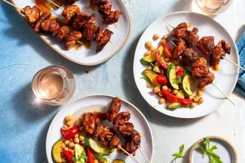 Moroccan spiced chicken skewers with chickpea and tomato salad