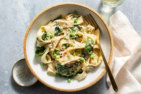 Veggie pappardelle al limone with spinach and sweet peas