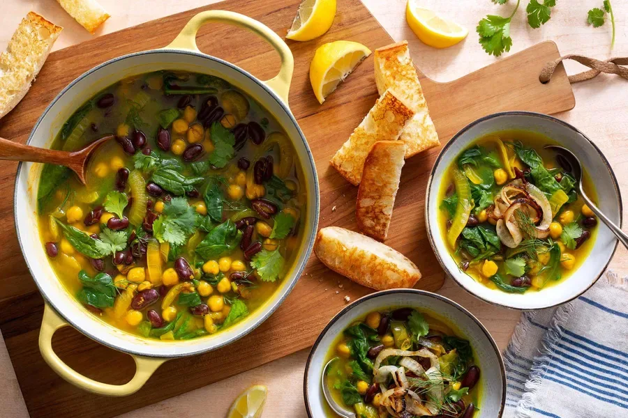 Two bean soup with spinach, caramelized onions, and toasted ciabatta