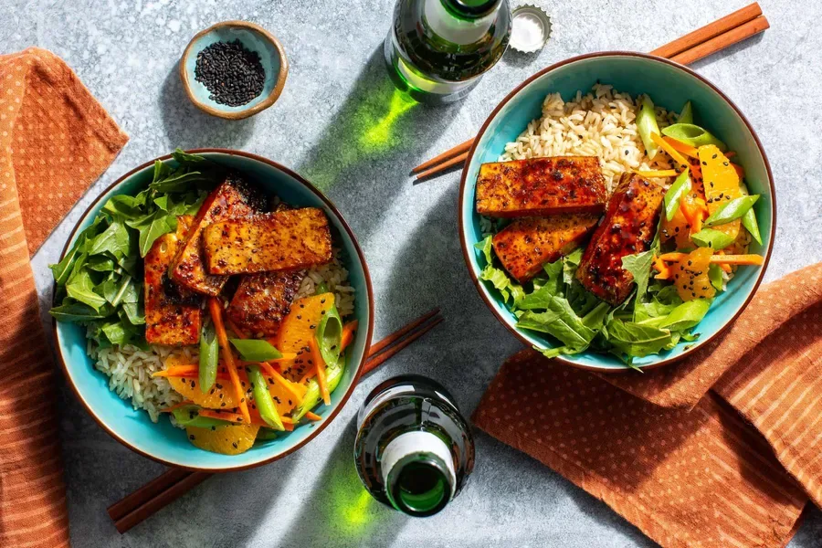 Sweet and sticky tofu rice bowls with arugula orange salad