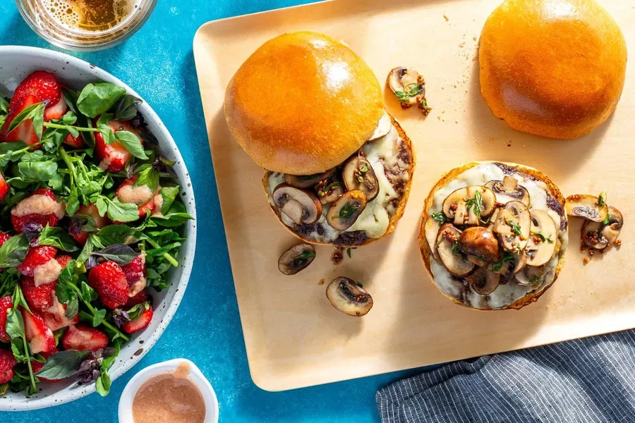 Mushroom Gruyère Wagyu burgers with strawberry and watercress salad