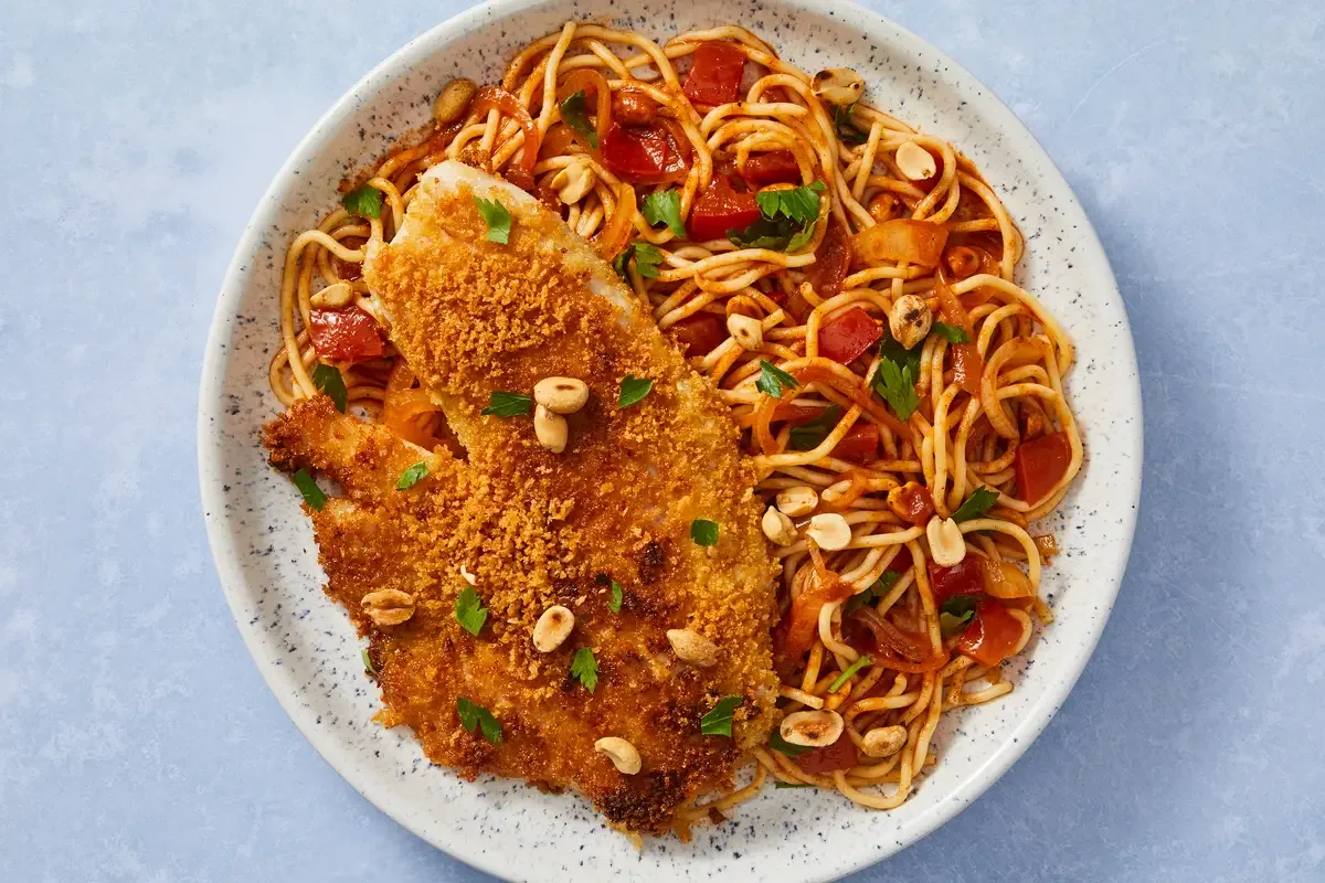 Crispy Salmon over Senegalese Style Spaghetti