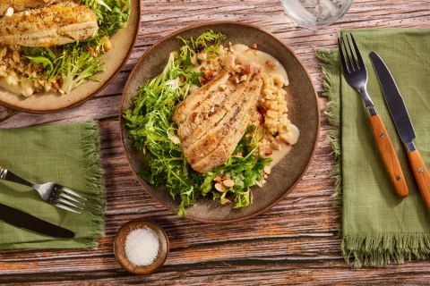 Tilapia over couscous with citrus beurre blanc and fris&eacute;e-arugula salad