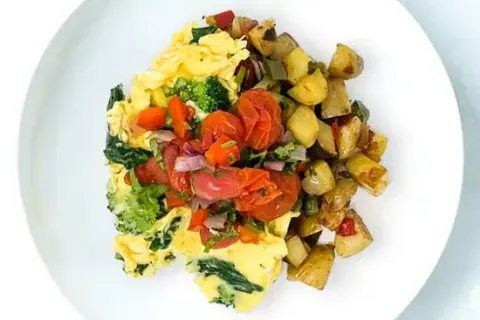 Spinach And Broccoli Scrambled Eggs With Yukon Gold Potato Hash And Pico De Gallo