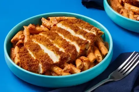 Crispy Chicken Cutlets over Penne Rosa