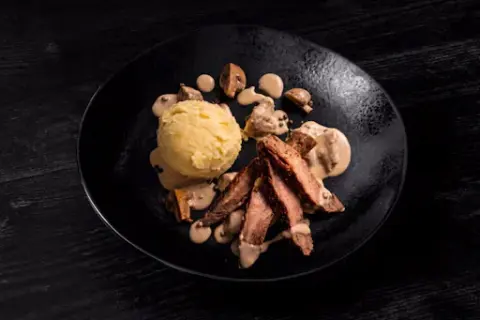Flank Steak with Brandy-Peppercorn Sauce