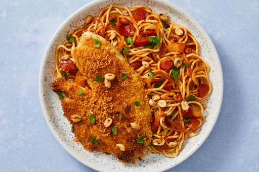 Crispy 2x Tilapia over Senegalese-Style Spaghetti