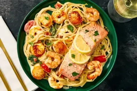 Salmon “en Papillote” over 2x Shrimp Linguine